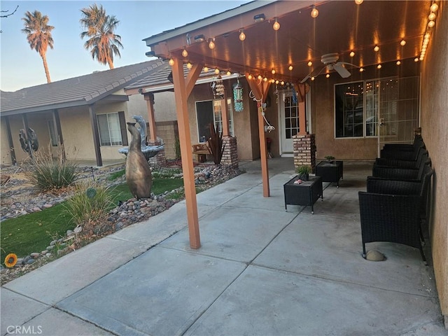 view of patio with a ceiling fan and an outdoor hangout area