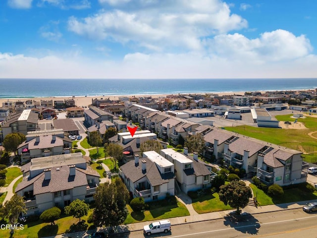 drone / aerial view with a water view and a residential view