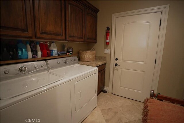 25841 Remington Ct, Tehachapi, CA 93561 - clothes washing area with cabinet space, washer and clothes dryer, and light tile patterned floors