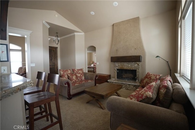25841 Remington Ct, Tehachapi, CA 93561 - living area featuring carpet floors, arched walkways, crown molding, a fireplace with raised hearth, and a chandelier