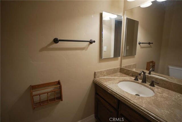 25841 Remington Ct, Tehachapi, CA 93561 - bathroom featuring toilet and vanity