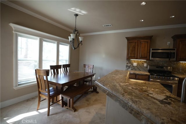 25841 Remington Ct, Tehachapi, CA 93561 - dining area with crown molding, a healthy amount of sunlight, light tile patterned floors, and baseboards