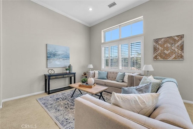 living area with visible vents, crown molding, light carpet, and baseboards