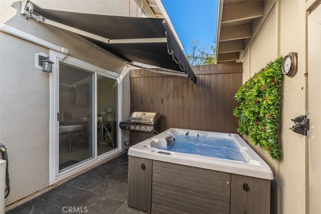 view of patio with fence and area for grilling