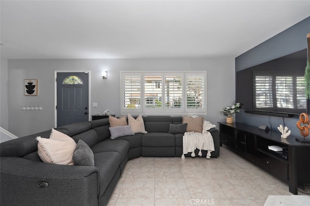 living room with light tile patterned flooring