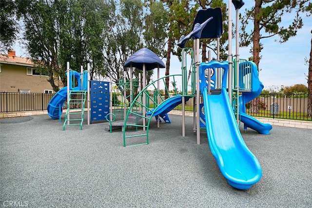 community jungle gym featuring fence