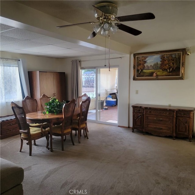 dining space featuring light colored carpet