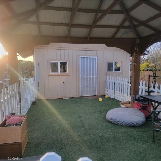 view of outbuilding with fence