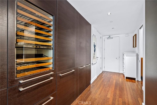 corridor with recessed lighting and wood finished floors