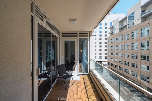 balcony featuring a sunroom