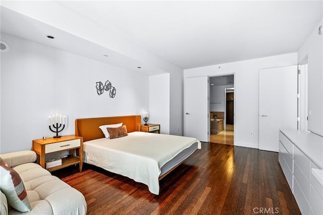 bedroom featuring dark wood-type flooring