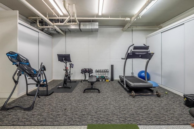 exercise room with concrete block wall