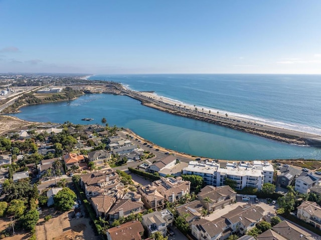 aerial view featuring a beach view, a water view, and a residential view