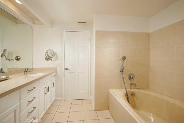 bathroom featuring tile patterned flooring, shower / tub combination, visible vents, and vanity