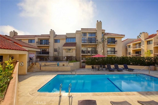 community pool featuring a patio