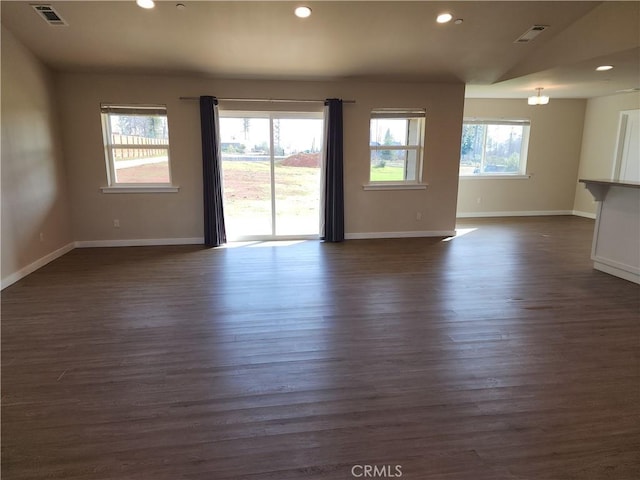 unfurnished room with recessed lighting, baseboards, and visible vents