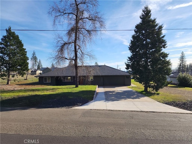 ranch-style home with driveway, a front lawn, and a garage
