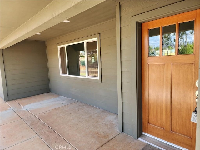 entrance to property featuring a patio area
