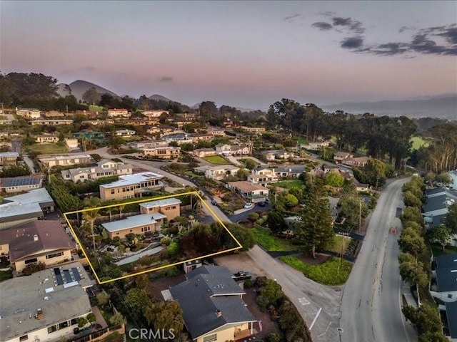 birds eye view of property with a mountain view and a residential view