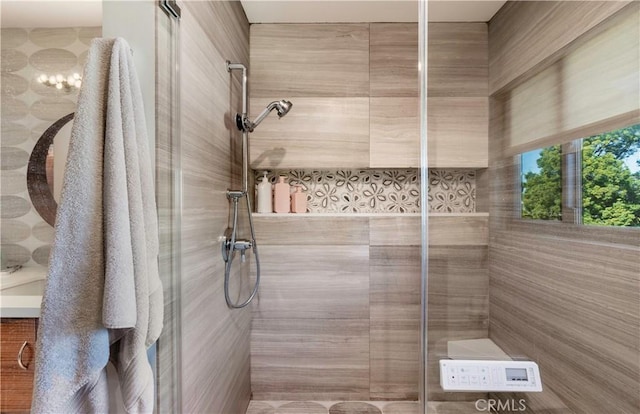 full bathroom with tiled shower