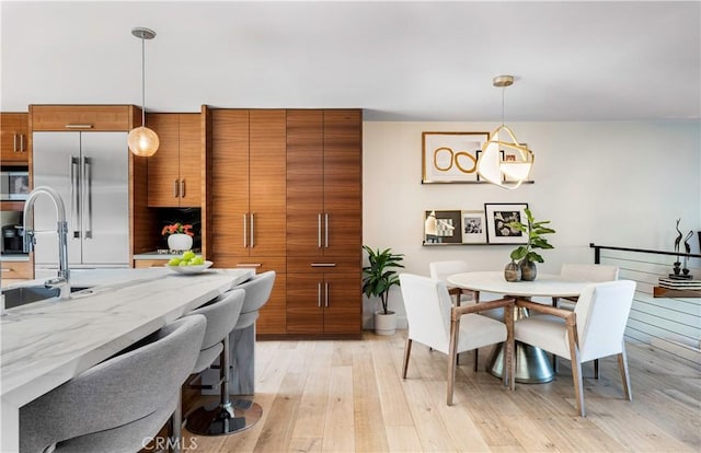 dining area featuring light wood-type flooring