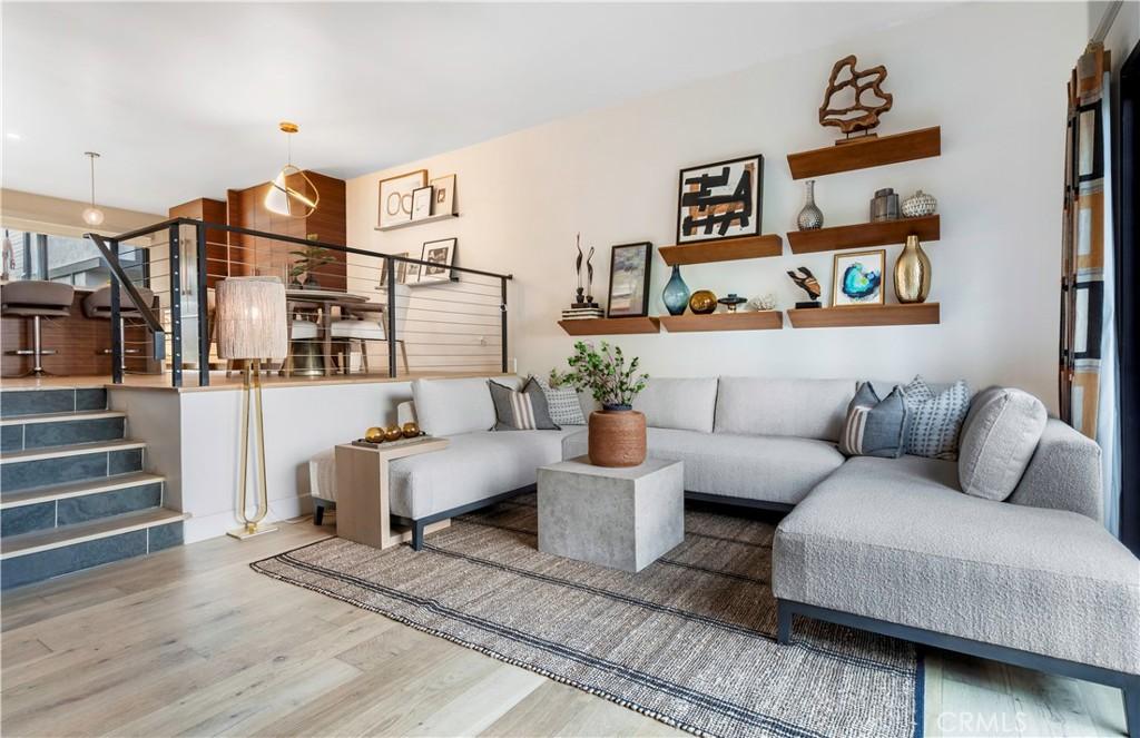living room featuring stairway and wood finished floors