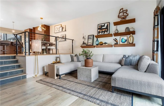 living room featuring stairway and wood finished floors