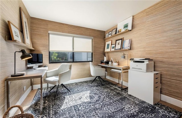 office space with baseboards and built in study area