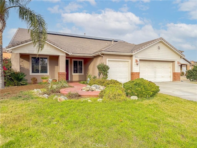 ranch-style house featuring concrete driveway, an attached garage, a tile roof, and a front yard