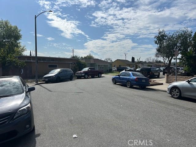 uncovered parking lot featuring a residential view