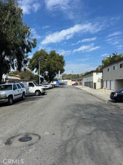 view of street with street lighting, curbs, and sidewalks