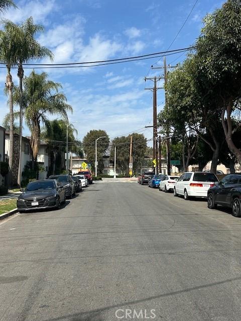 view of street with street lighting, curbs, and sidewalks