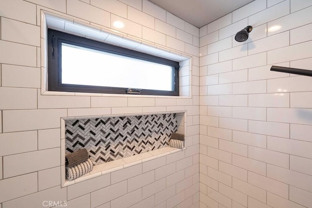 bathroom with a tile shower