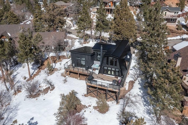 snowy aerial view featuring a residential view