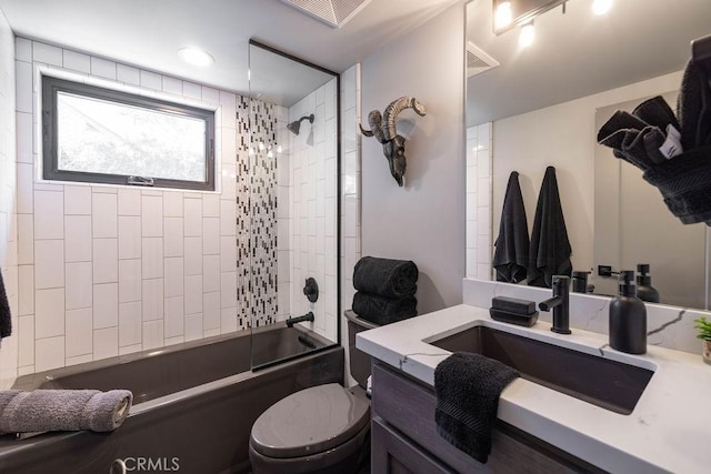 bathroom featuring toilet, shower / bath combination, visible vents, and vanity