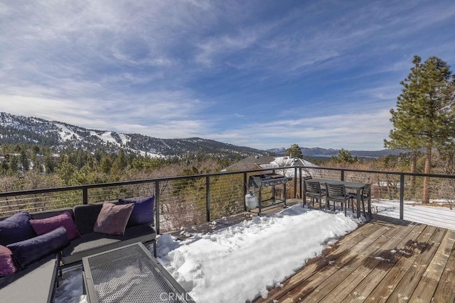 wooden terrace featuring a mountain view