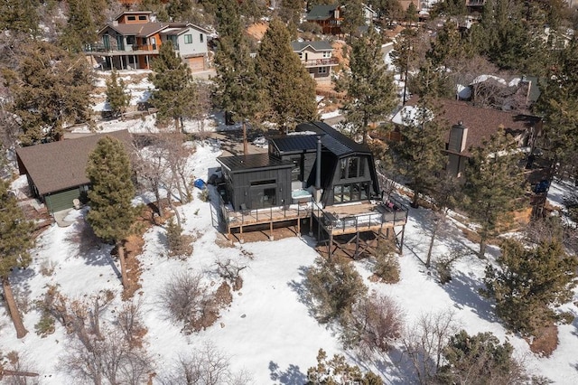 snowy aerial view featuring a residential view