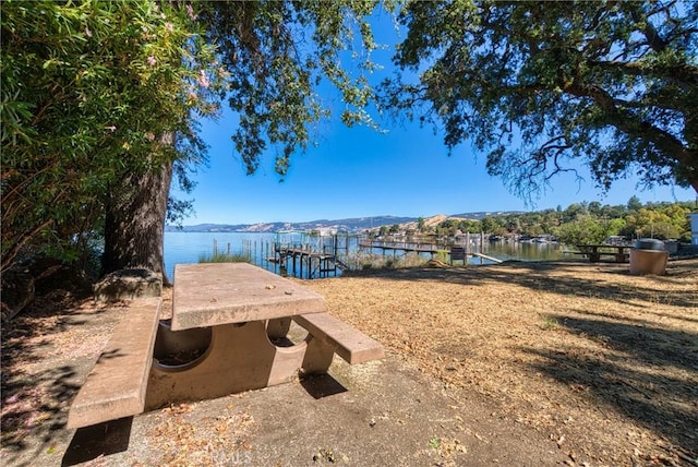 dock area with a water and mountain view