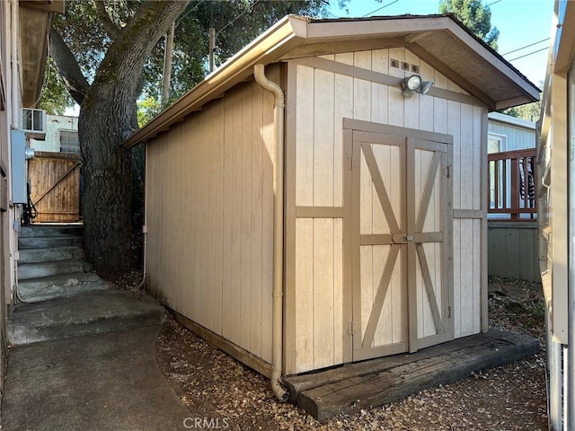 view of shed with fence