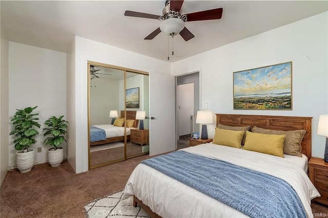 carpeted bedroom with ceiling fan and a closet