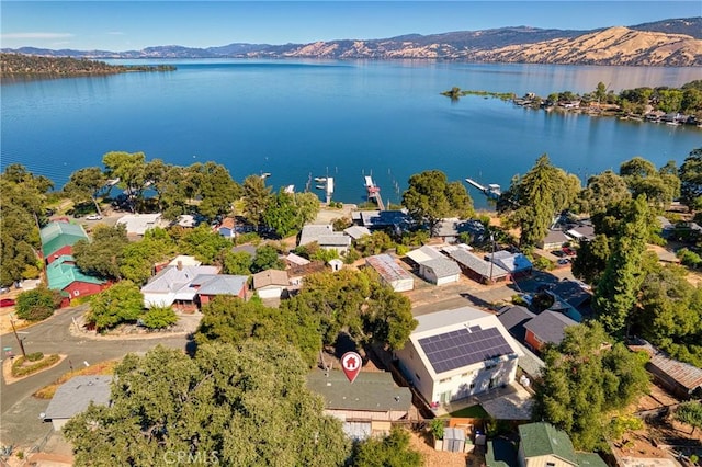 birds eye view of property with a residential view and a water and mountain view