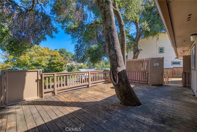 wooden deck featuring fence