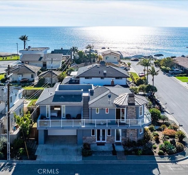 bird's eye view with a water view and a residential view