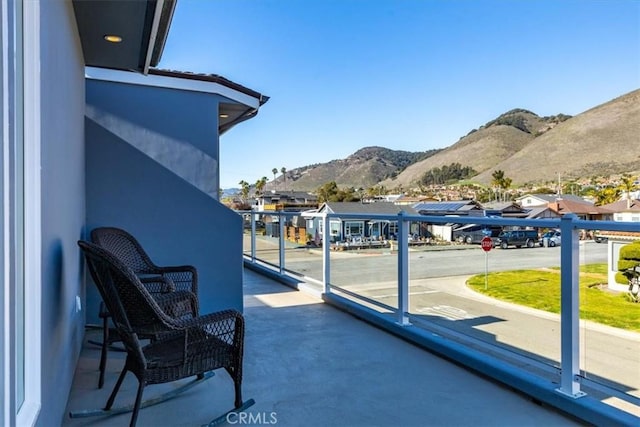 balcony featuring a mountain view