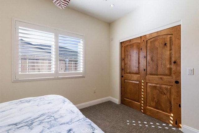 carpeted bedroom with baseboards