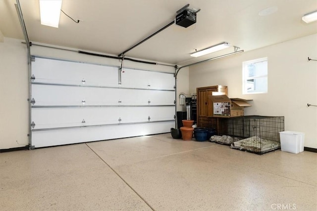 garage featuring baseboards and a garage door opener