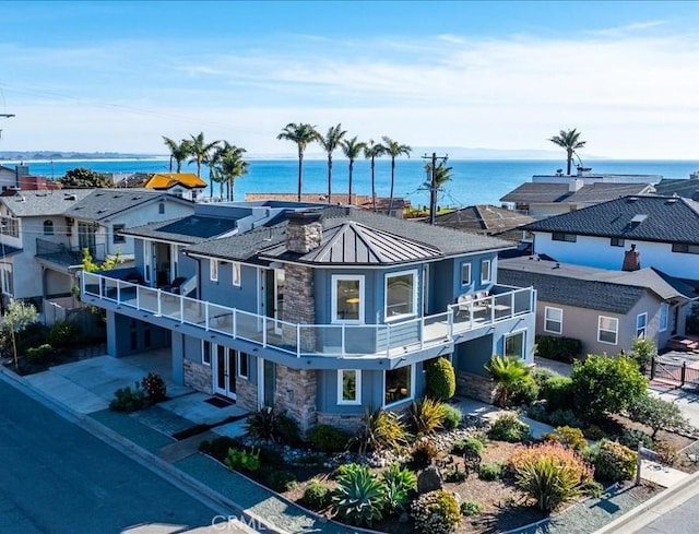 aerial view featuring a water view and a residential view