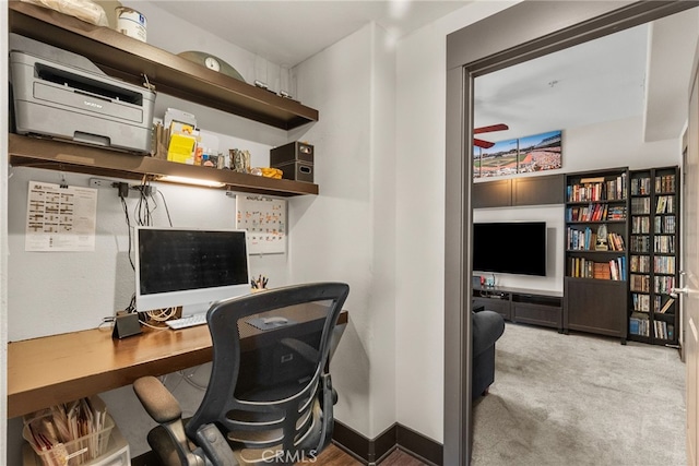 carpeted office with baseboards