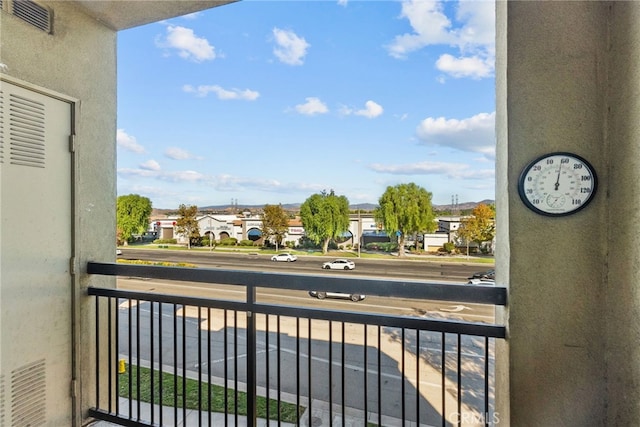 balcony with visible vents and a residential view