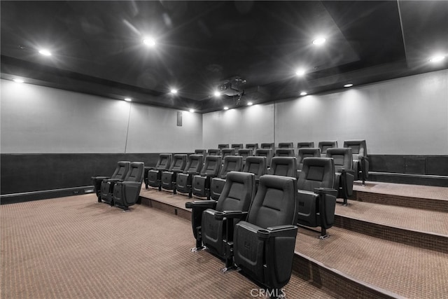 cinema room featuring carpet floors, recessed lighting, and a wainscoted wall